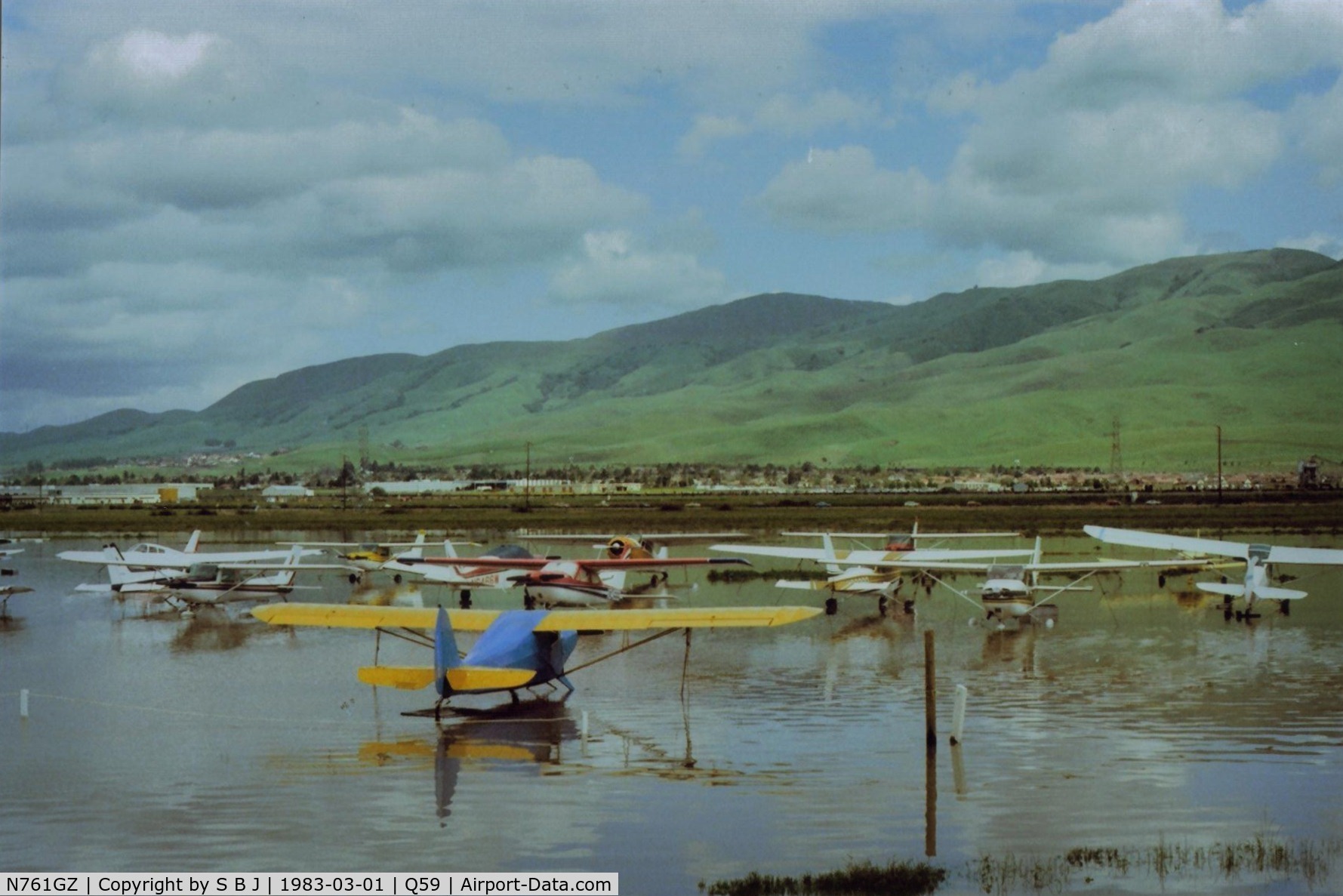 N761GZ, Cessna A152 Aerobat C/N A1520953, 1GZ (Cessna 152) seen on the left side of the yellow (Chief) wing with its feet wet during an early 80s Fremont flood.Sadly now the entire plane is under water due to a tragic accident on 6-19-94.