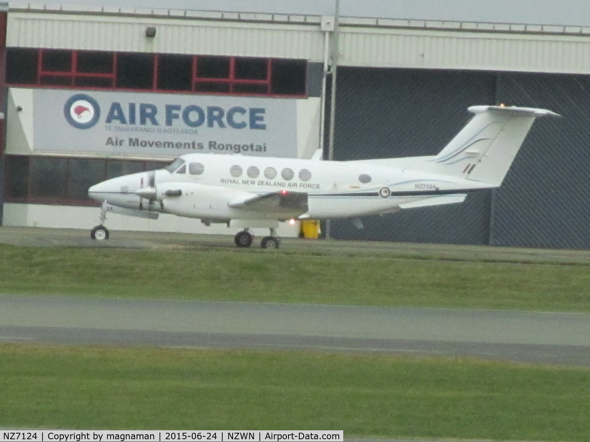 NZ7124, 2006 Raytheon B200 King Air C/N BB-1949, At welly - log shot across airfield from departure lounge