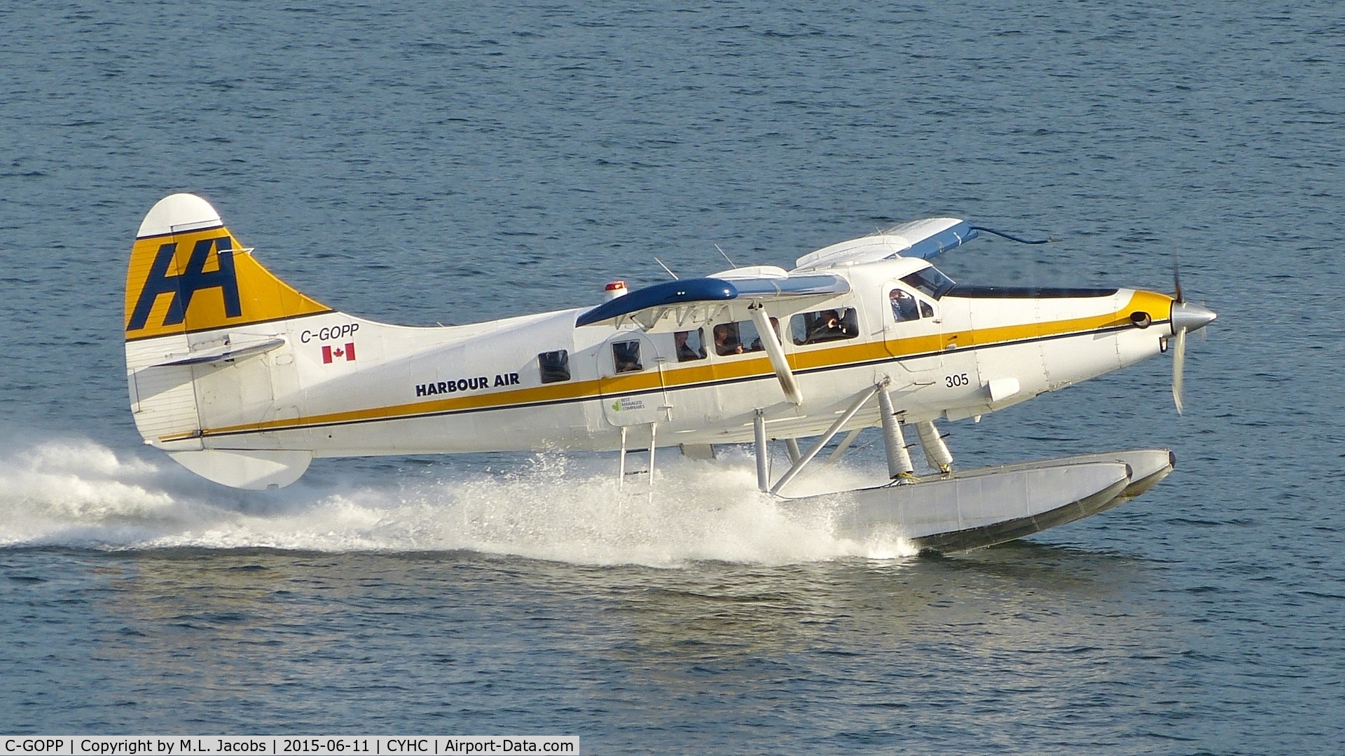 C-GOPP, 1959 De Havilland Canada DHC-3 Turbo Otter C/N 355, Harbour Air #305 just landed in Coal Harbour and pulling to a stop.