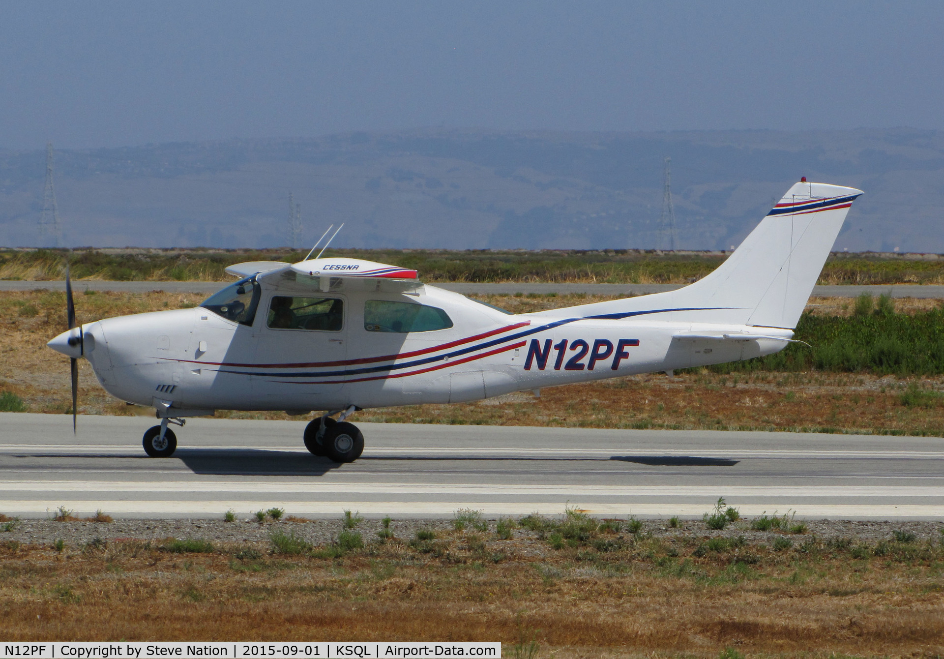 N12PF, 1977 Cessna T210M Turbo Centurion C/N 21062401, Locally-based Cessna T210M taking off @ San Carlos Airport, CA