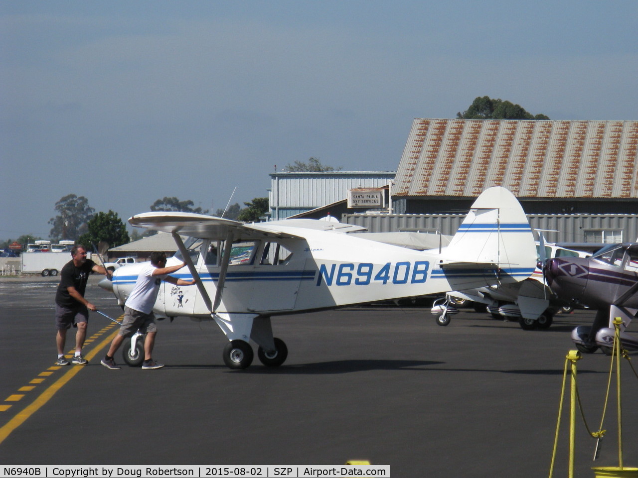 N6940B, 1956 Piper PA-22-150 Tri-Pacer C/N 22-4219, 1956 Piper PA-22 150 TRI-PACER, Lycoming O-320 150 Hp, spotting the aircraft on transient ramp