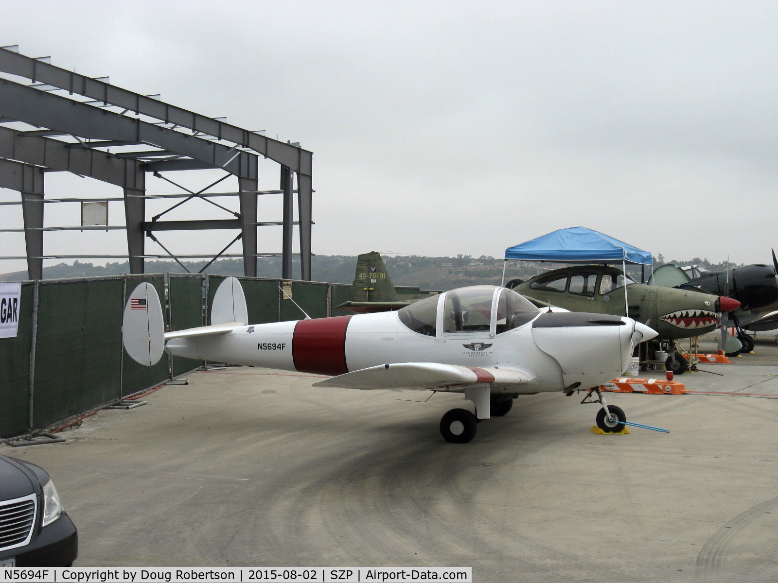 N5694F, 1966 Alon A2 Aircoupe C/N A-194, 1966 Alon A2 AIRCOUPE, Continental C90 90 Hp. New construction CAF SoCal Wing hangar in build, background. See more under Airports-CMA, KCMA.