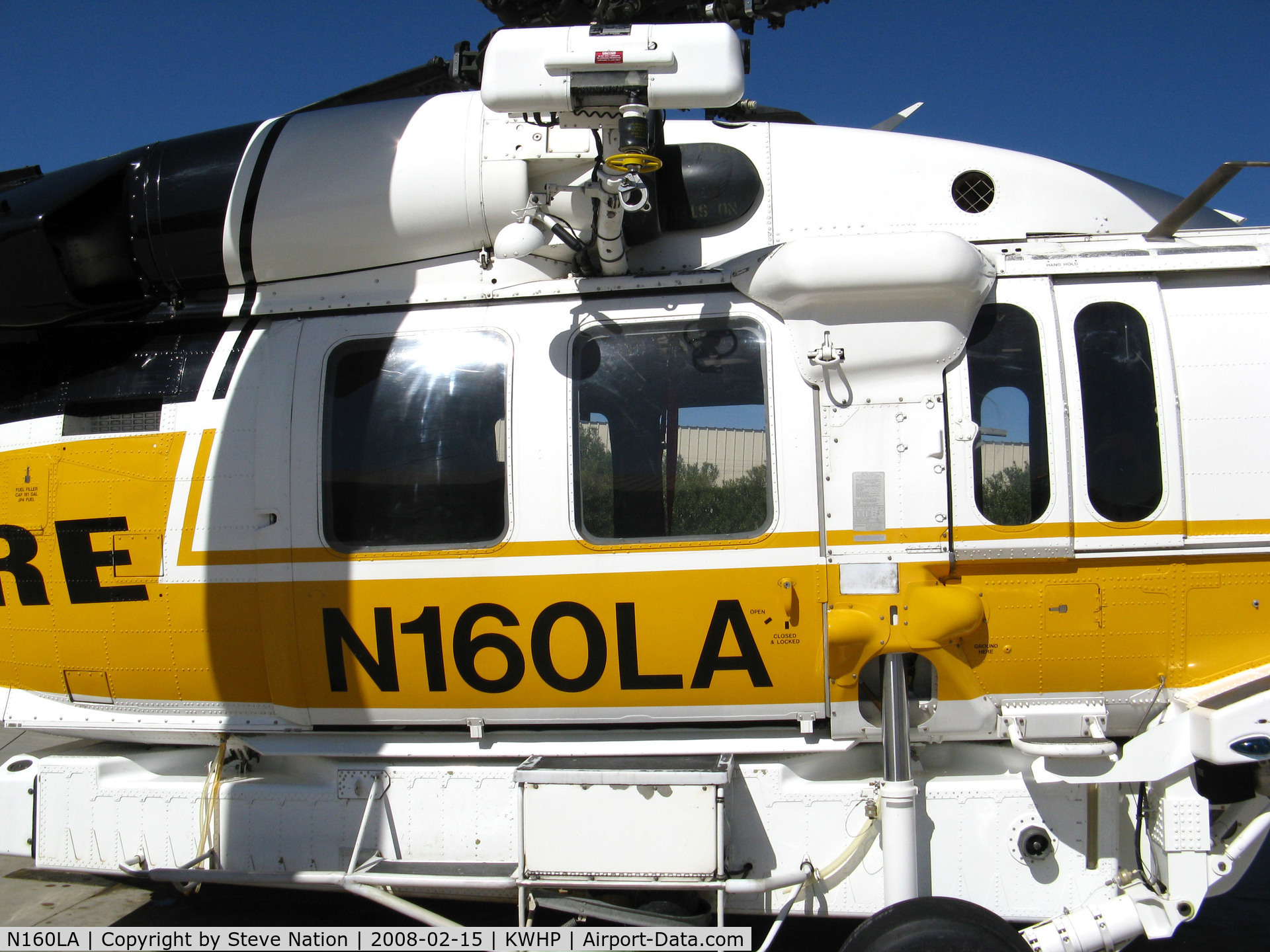 N160LA, 2000 Sikorsky S-70A Firehawk C/N 702453, CLOSE-UP Winch + Door on Los Angeles County Fire 2000 Sikorsky S-70A Firehawk Helitanker #16 on ramp @ Whiteman Airport, Pacoima, CA home base