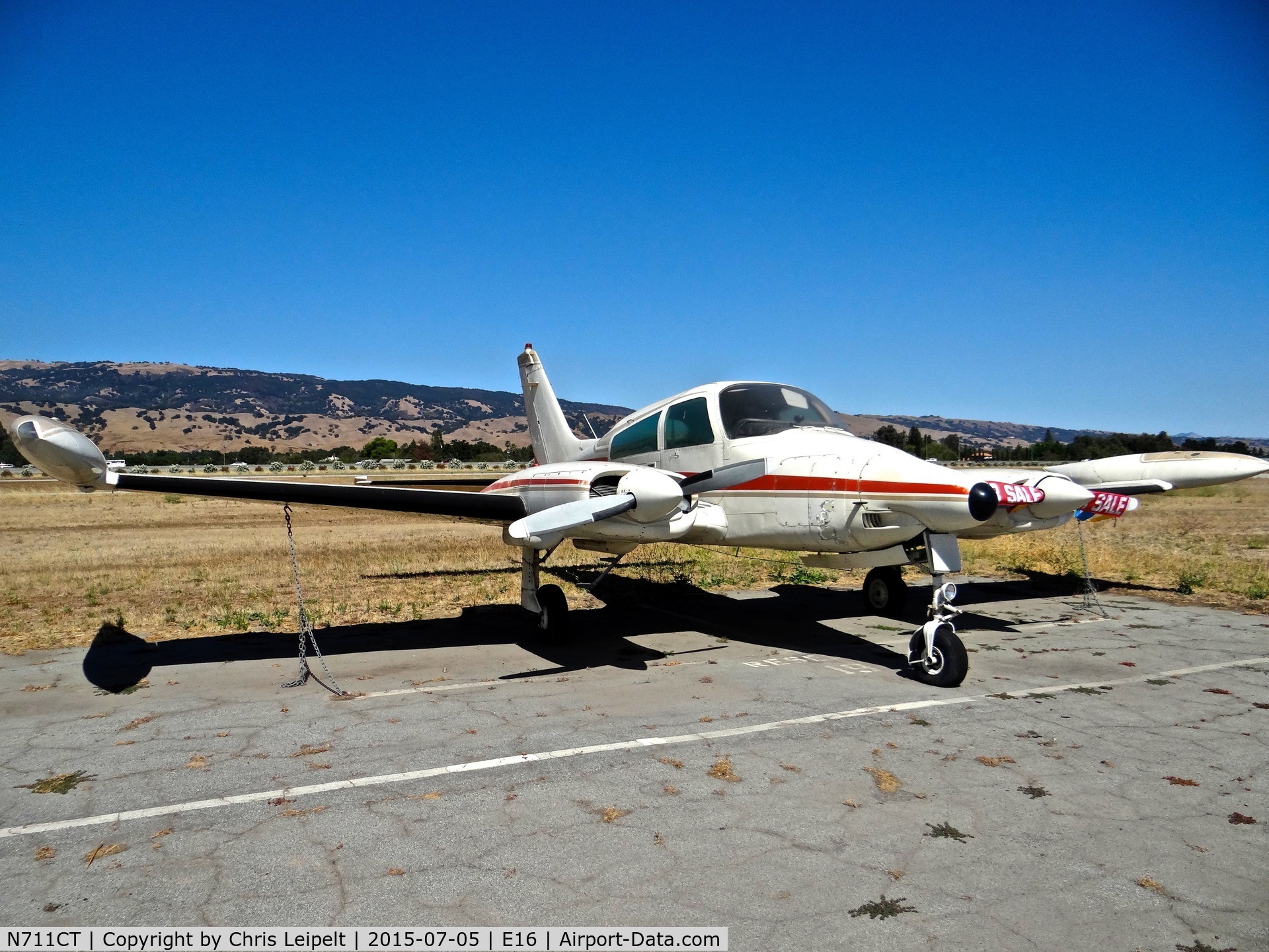 N711CT, 1973 Cessna 310Q C/N 310Q0677, Locally-based 1973 Cessna 310Q sitting at its tie down at South County Airport, San Martin, CA. It has been for sale for quite some time.
