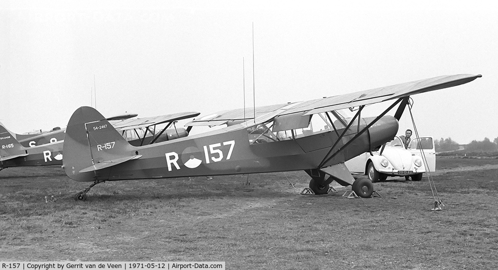 R-157, 1954 Piper L-21B Super Cub (PA-18-135) C/N 18-3847, The 54-2447 with many other L21's and Beaver S-8 'on the flightline' at Ermelo LAS
