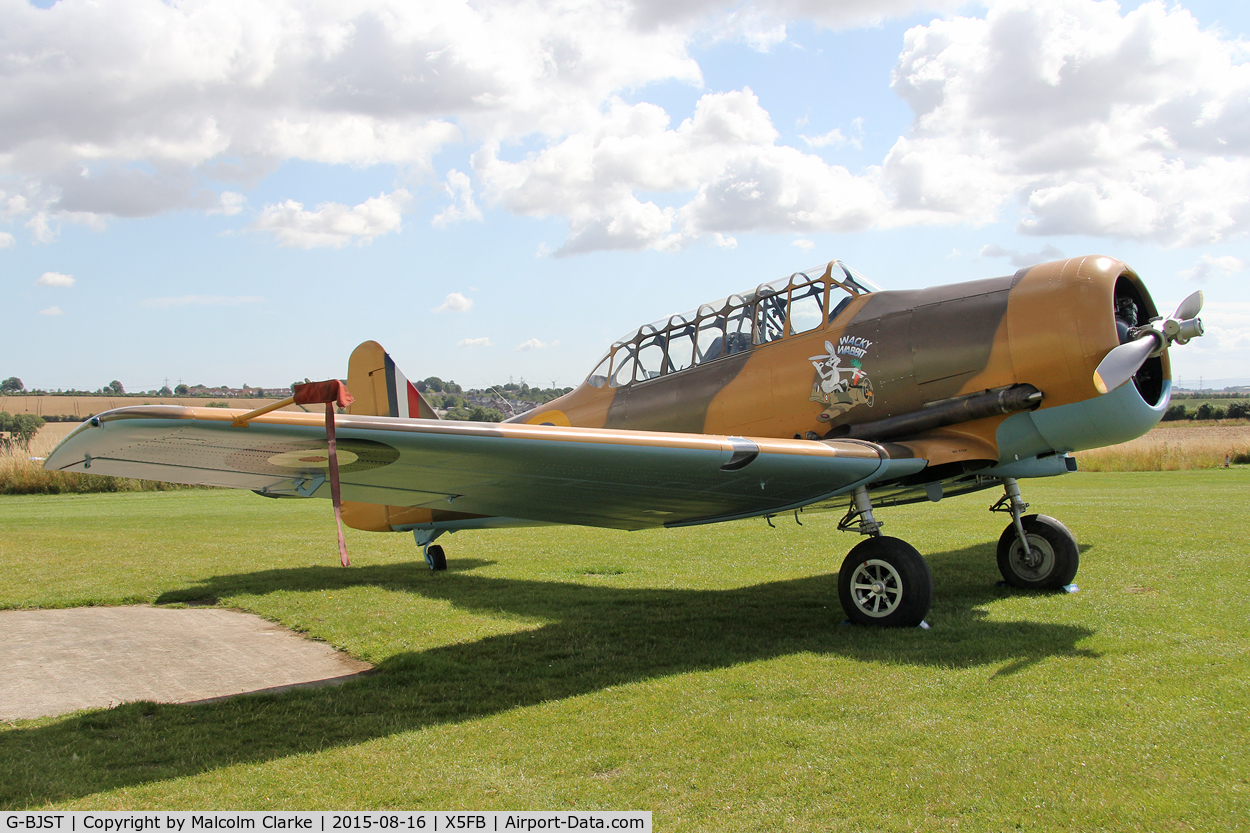 G-BJST, 1953 Canadian Car & Foundry T-6H Harvard Mk.4M C/N 14A-2429, Canadian Car & Foundry T-6H Harvard Mk4M in new camouflage finish by RS Paintworks at Fishburn Airfield, August 16th 2015.