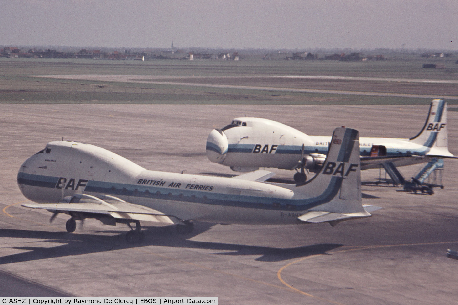 G-ASHZ, 1944 Aviation Traders ATL-98 Carvair (C-54B) C/N 27249, G-ASHZ is leaving the apron while G-AOFW is waiting for loading at Ostend in early 1970's.