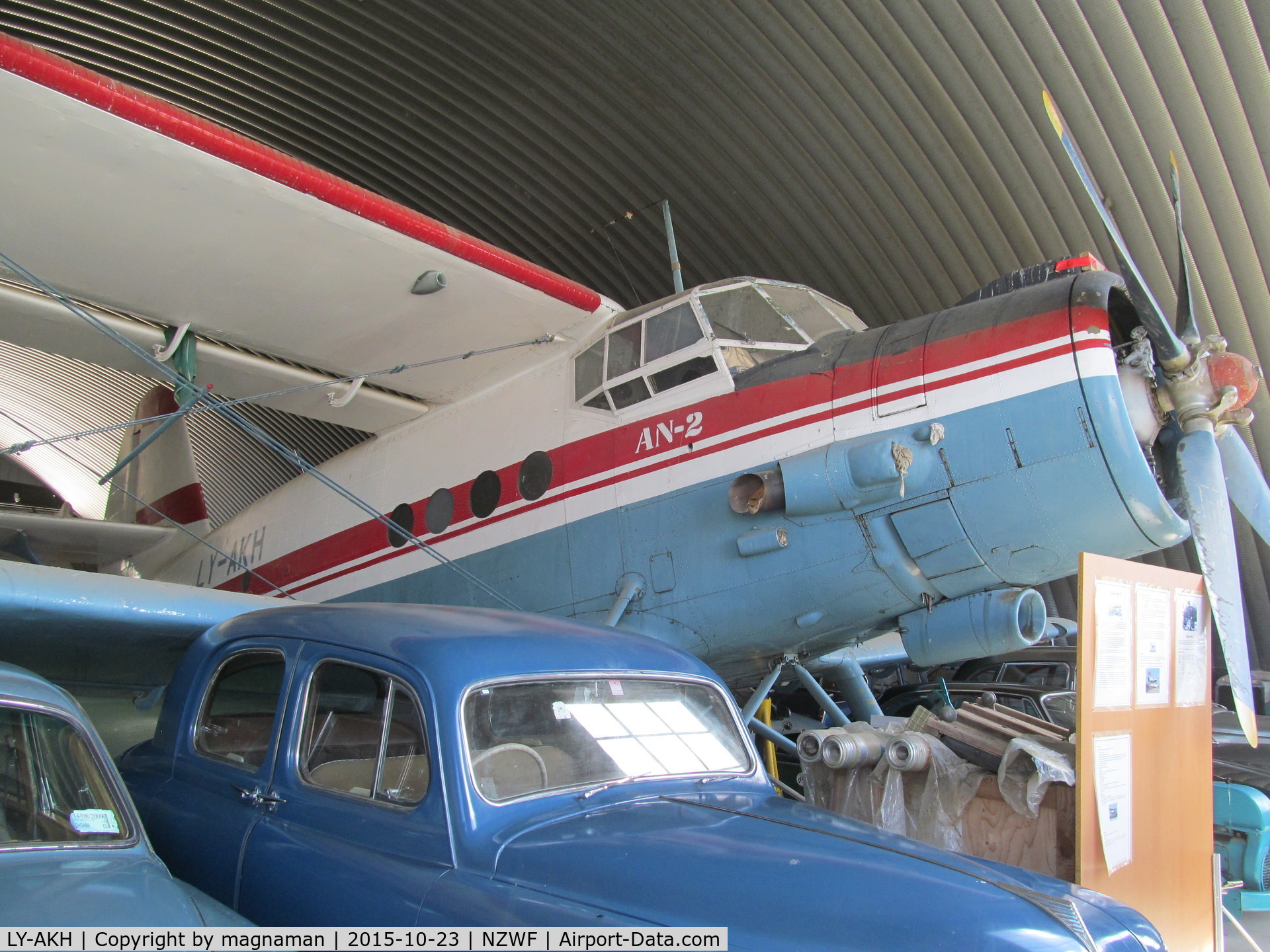 LY-AKH, Antonov An 2 C/N 1G16037, among loads of old cars at museum
