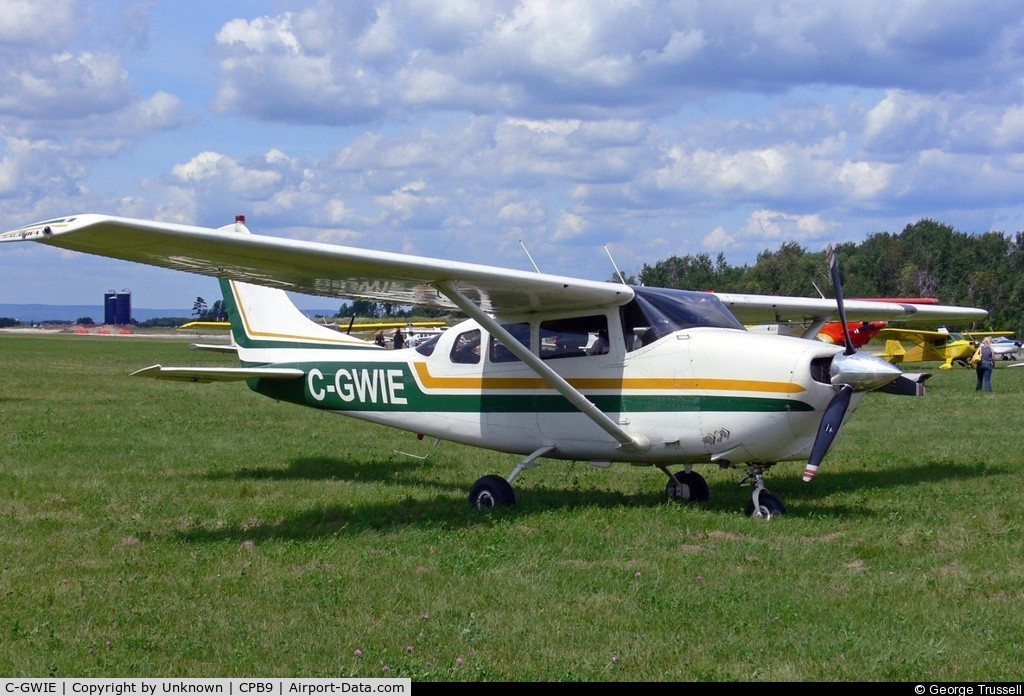 C-GWIE, 1963 Cessna 210-5A (205A) C/N 205-0498, Sitting in field at Baldwin, Ontario, were I purchased the aircraft and now it's home is Kincardine, Ontario CYKM.