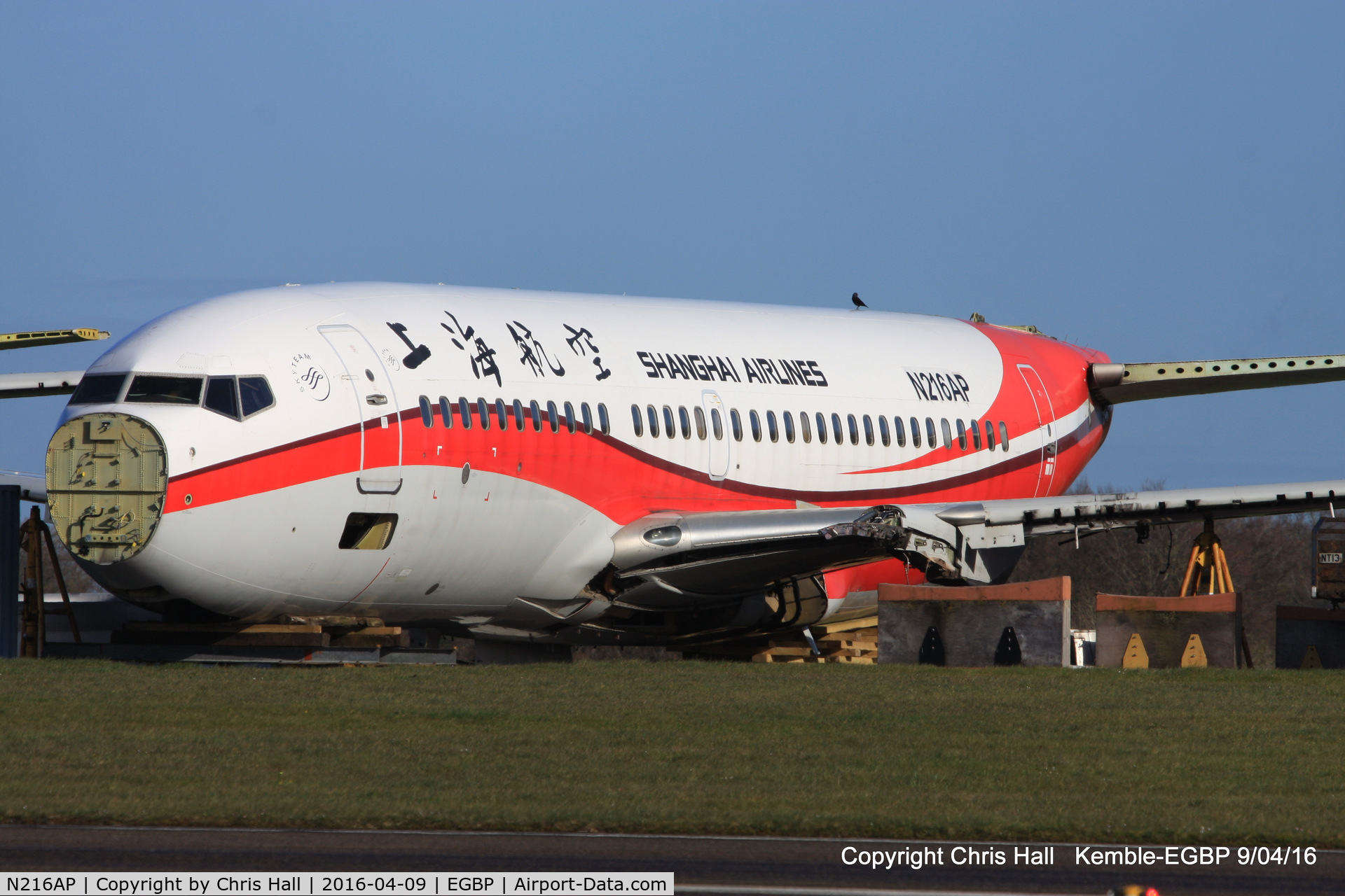 N216AP, 1998 Boeing 737-7Q8 C/N 28216, ex Shanghai Airlines in the scrapping area at Kemble
