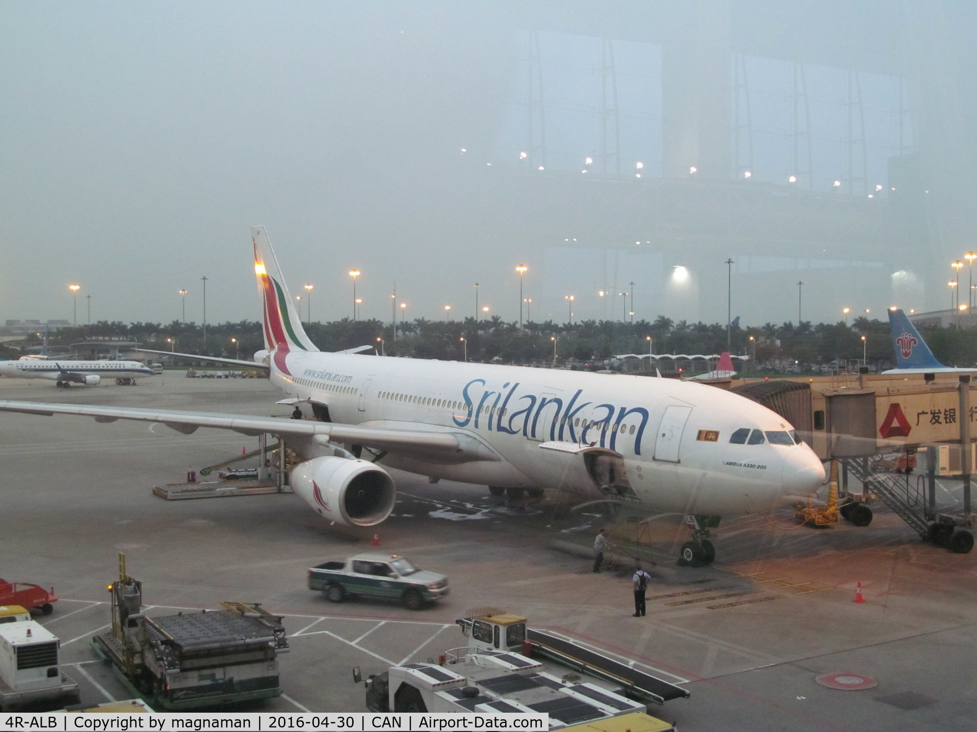 4R-ALB, 1999 Airbus A330-243 C/N 306, on apron - through glass