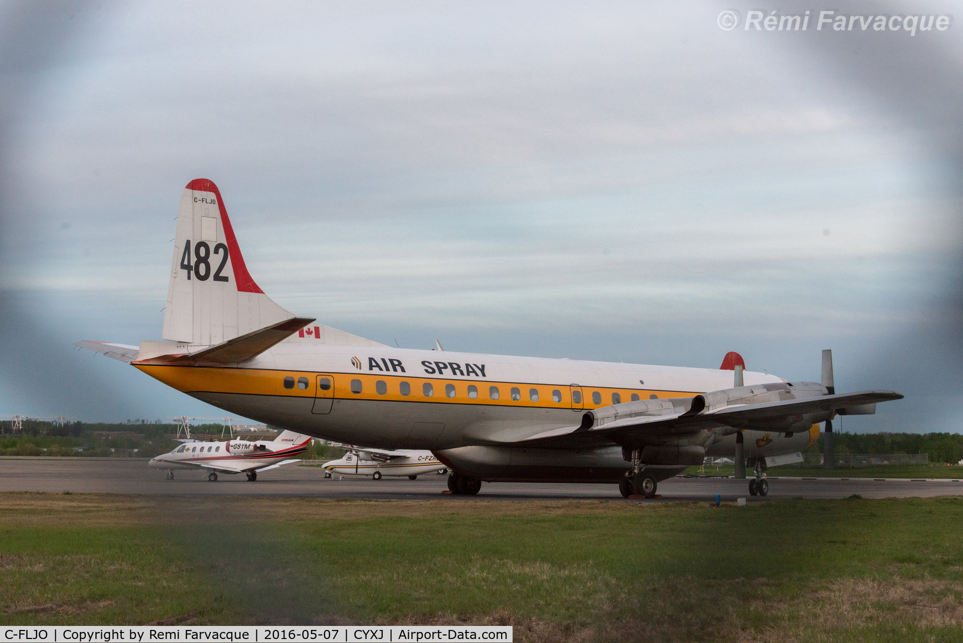 C-FLJO, Lockheed L-188C Electra C/N 1103, Parked north of control tower with other crsft involved in fighting the Beatton River and Siphon fires.