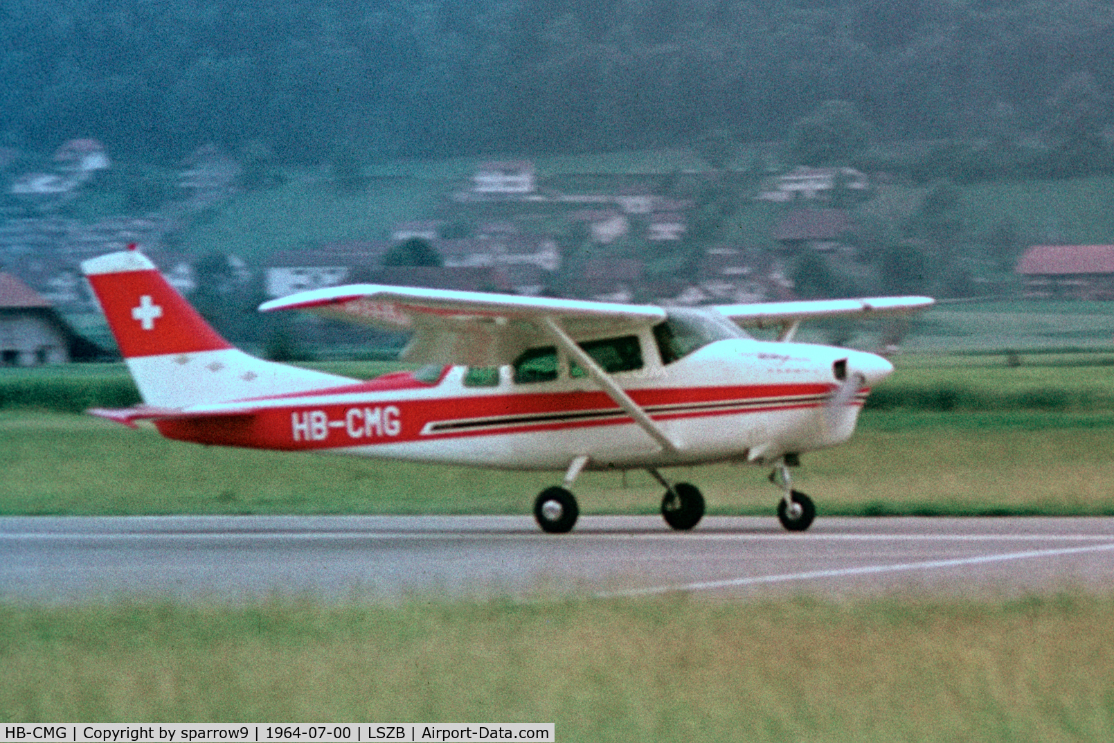 HB-CMG, 1963 Cessna 210C C/N 21058150, Taking-off rwy 32 Berne. Scanned from a slide.