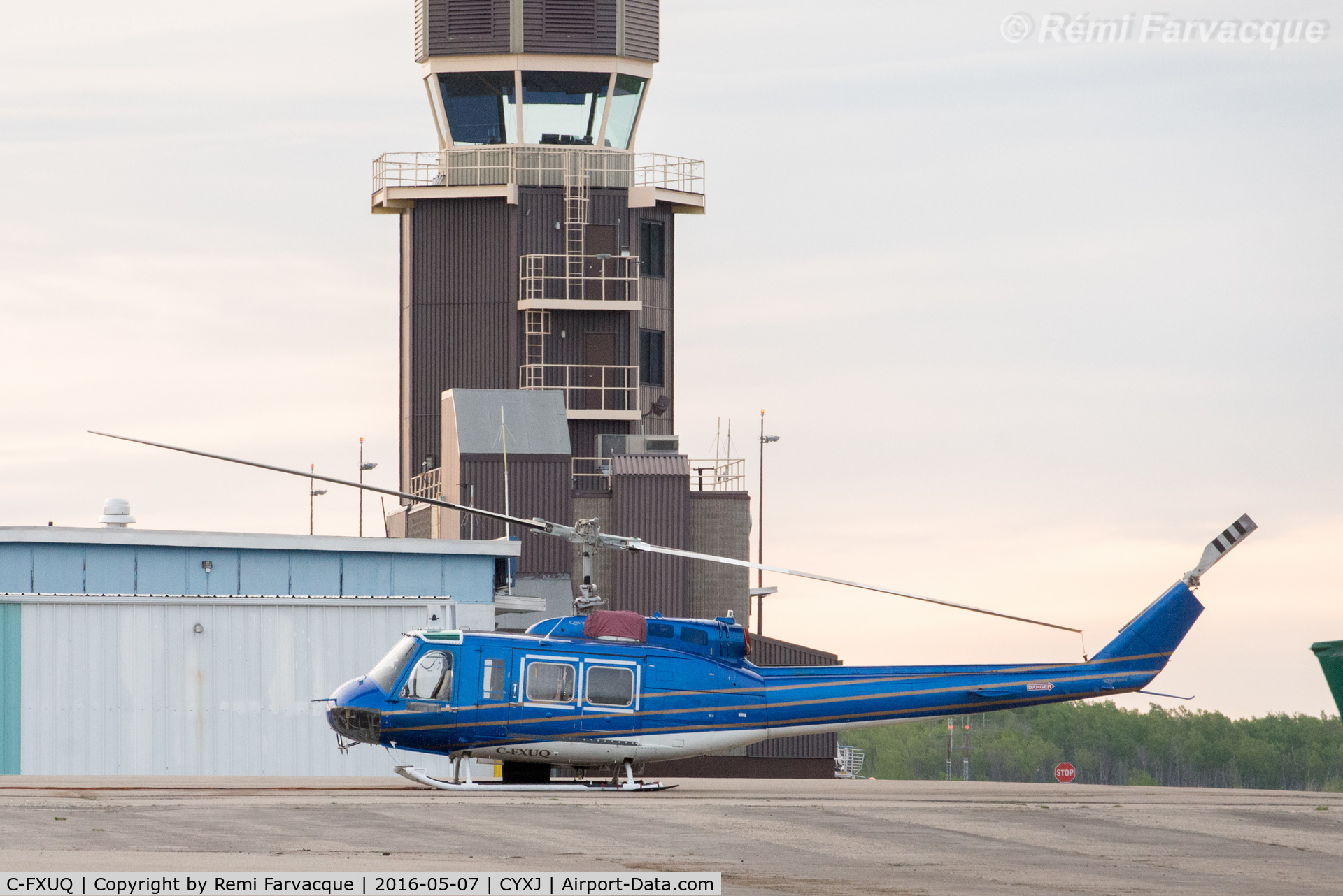 C-FXUQ, 1975 Bell 205A-1 C/N 30176, Parked by control tower. Fighting forest fires during the day.