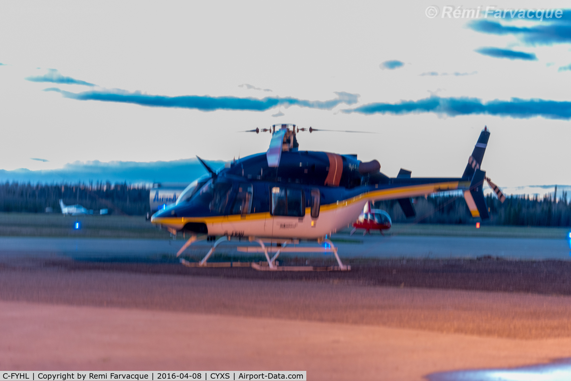 C-FYHL, 2000 Bell 427 C/N 56020, Parked south of main terminal. Horrible lighting.