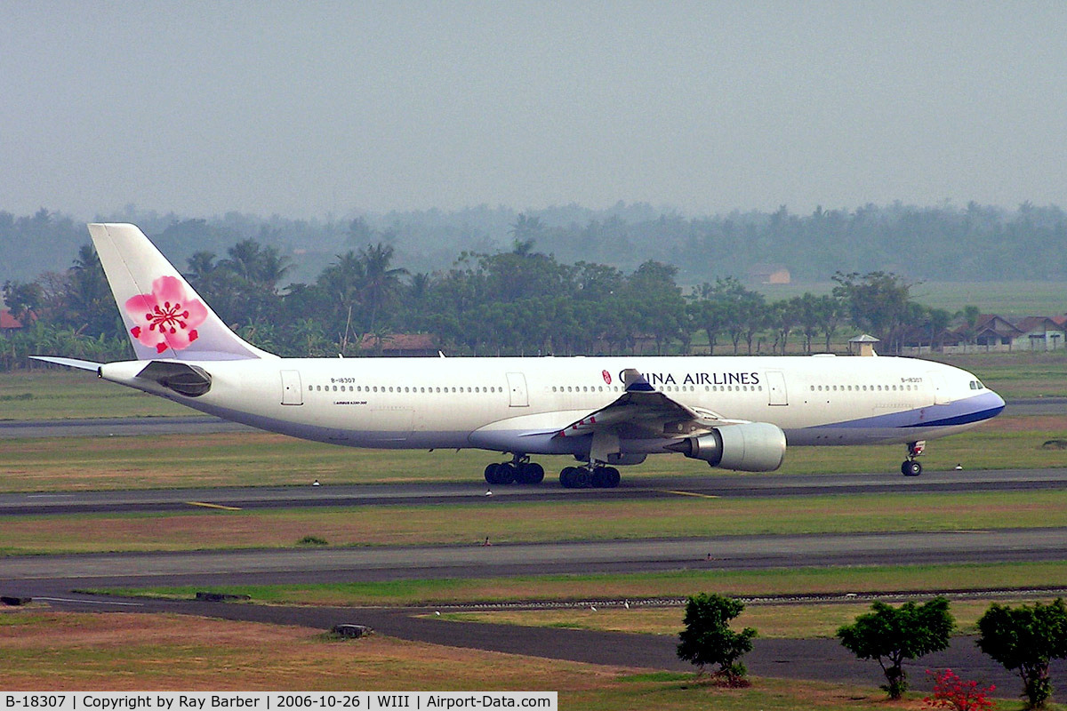 B-18307, 2005 Airbus A330-302 C/N 691, Airbus A330-302 [691] (China Airlines) Jakarta-Soekarno Hatta Int'l~PK 26/10/2006. Taken through glass window of hotel.