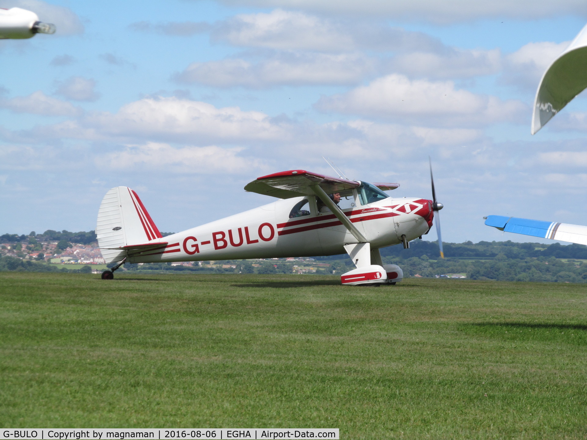 G-BULO, 1946 Luscombe 8F Silvaire C/N 4216, taxying past parked aircraft