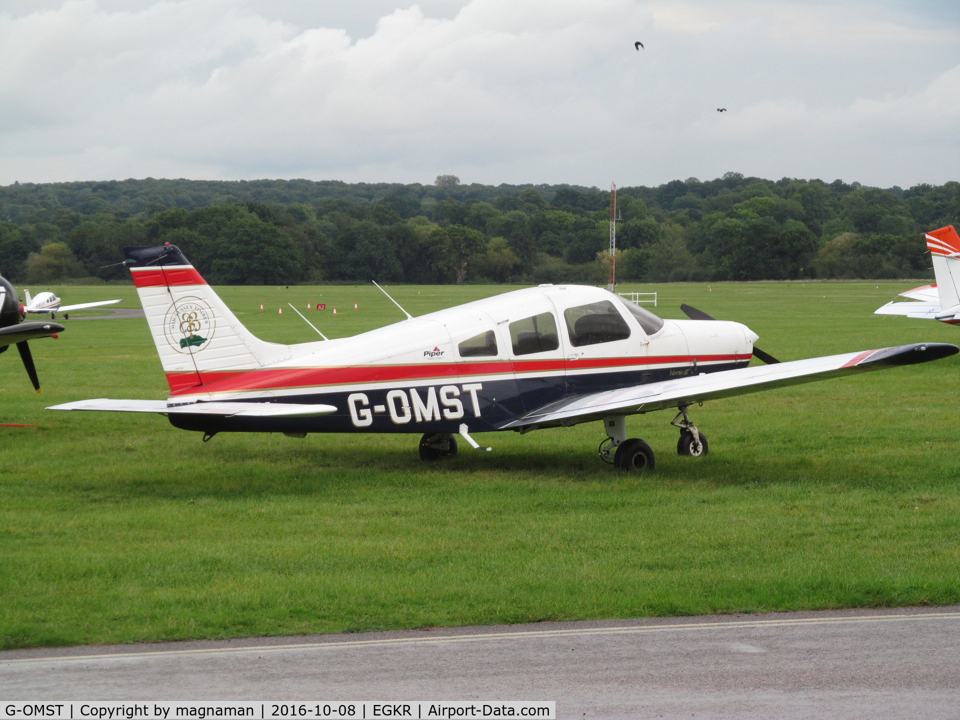 G-OMST, 2001 Piper PA-28-161 Cherokee Warrior III C/N 2842121, on grass at redhill
