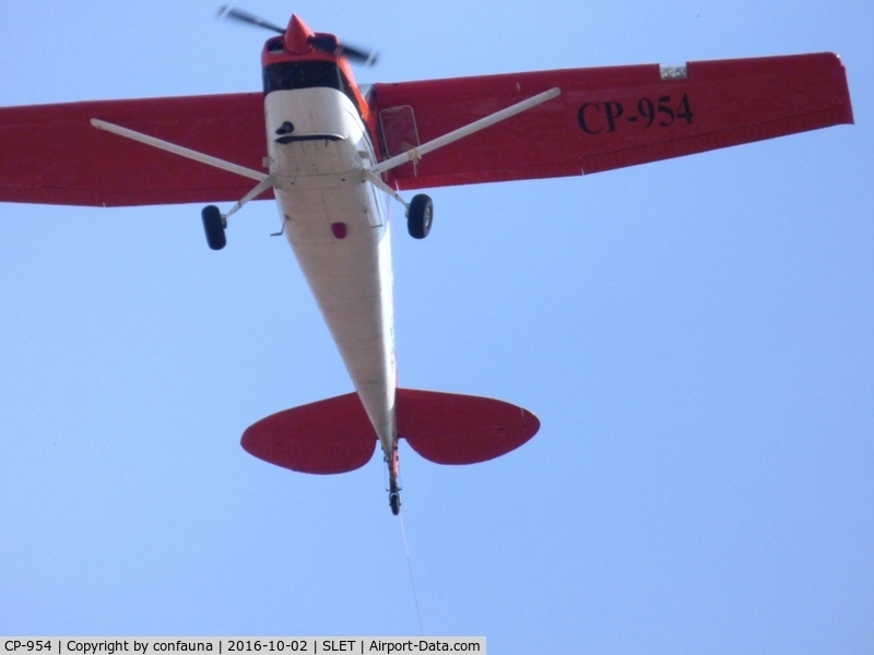 CP-954, Cessna 170B C/N 27071, Pulling an advertising sign (see the rope)