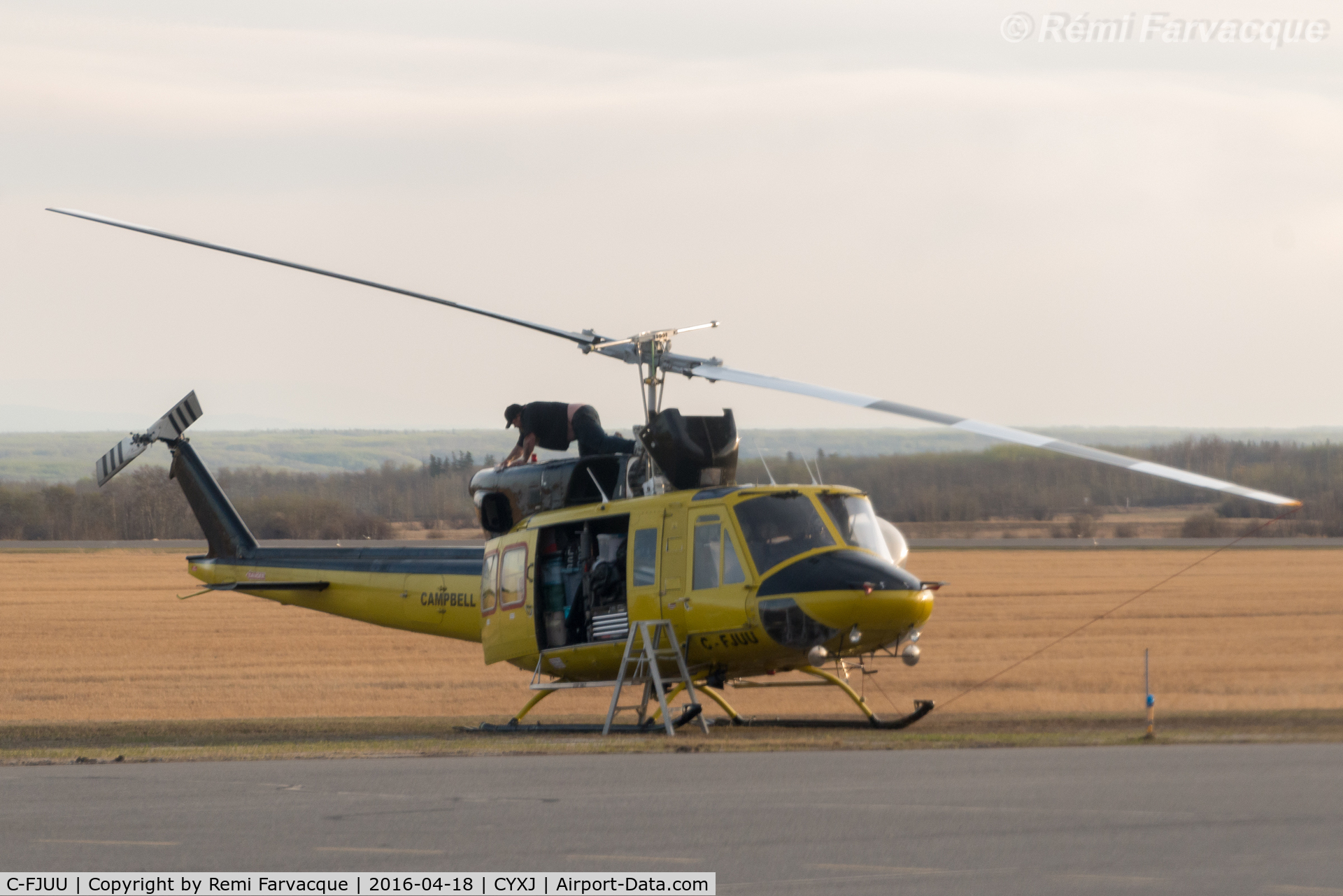 C-FJUU, 1976 Bell 212 C/N 30795, Maintenance in progress. Parked opposite main terminal.