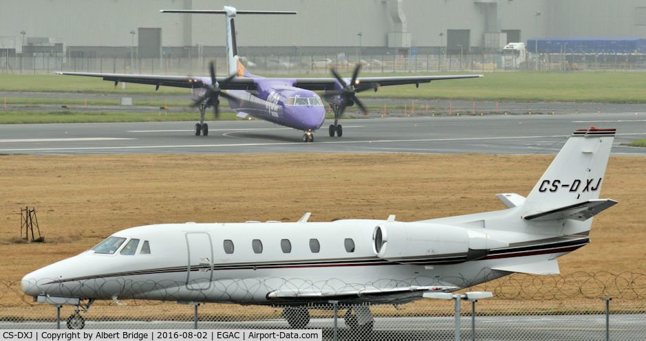 CS-DXJ, 2006 Cessna 560XL Citation Excel C/N 560-5627, Awaiting departure as flybe G-PRPC arrives (background).
