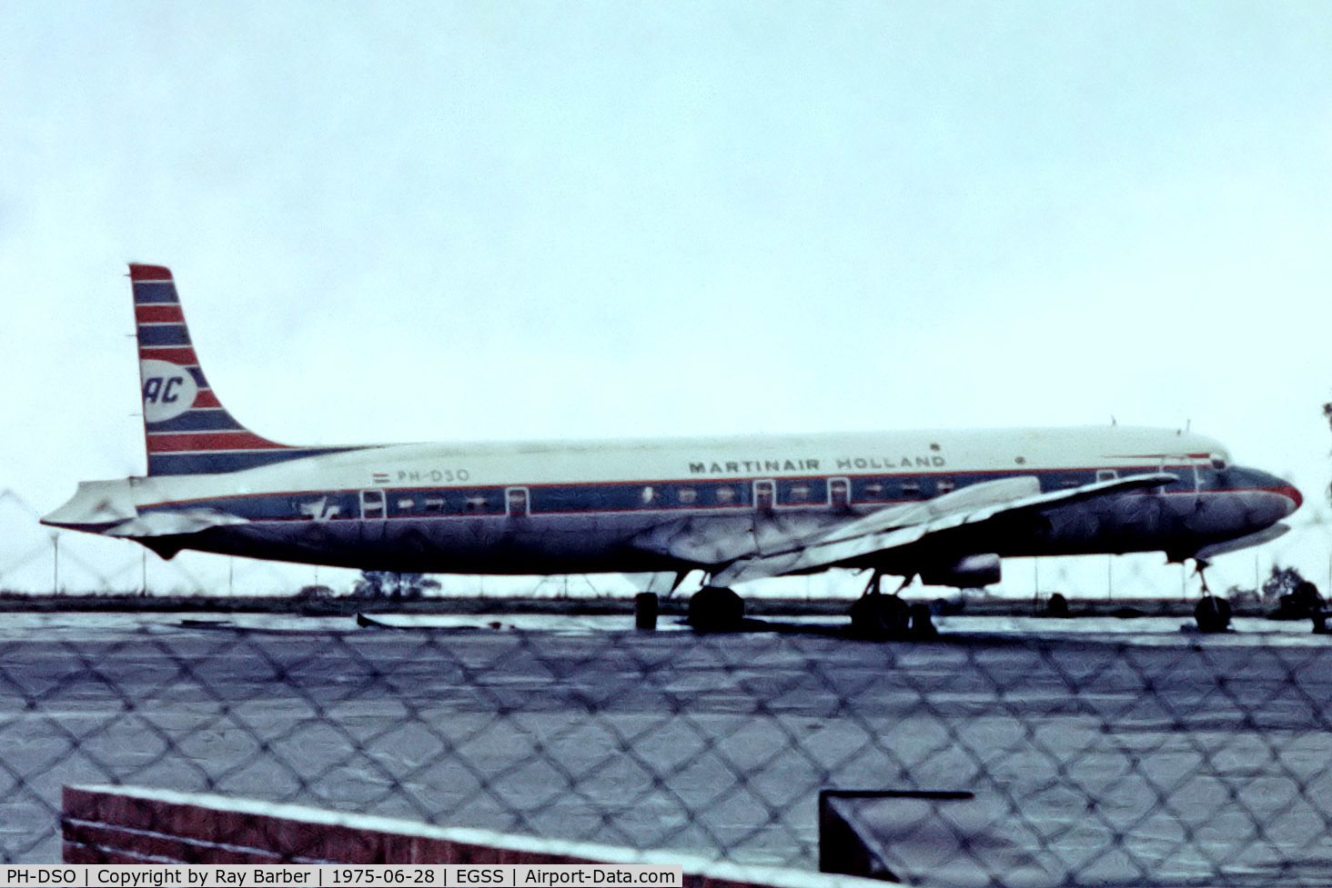 PH-DSO, 1958 Douglas DC-7C Seven Seas Seven Seas C/N 45547, Douglas DC-7C [45547] (Ex Martins Air Charter) Stansted~G 28/06/1975. From a slide. Taken through the fence.