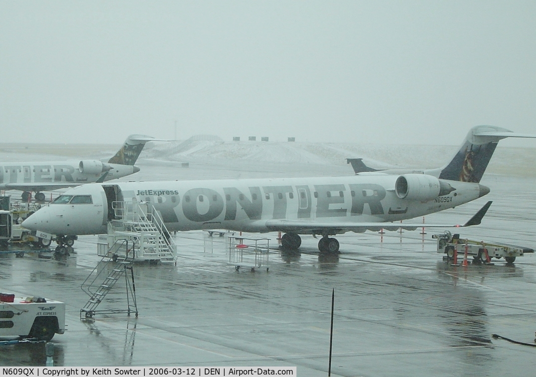 N609QX, 2001 Bombardier CRJ-701 (CL-600-2C10) Regional Jet C/N 10031, Parked on stand at Denver