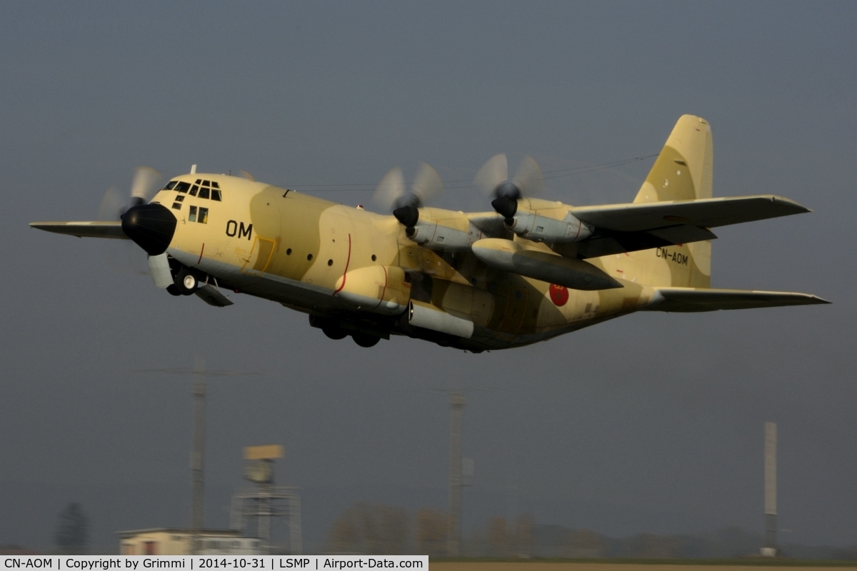 CN-AOM, 1980 Lockheed C-130H Hercules C/N 382-4875, Desert Beauty leaving Payerne in the early afternoon, the sun just eliminating the last bit of fog. The transport fleet was supporting the national disaster relief organisation for an exercise near Geneva.