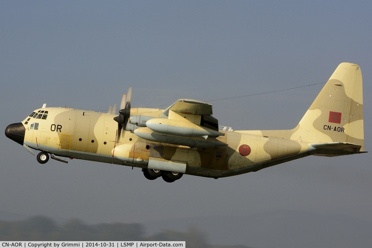 CN-AOR, 1981 Lockheed KC-130H Hercules C/N 382-4907, Another desert Beauty leaving Payerne in the early afternoon, the sun just eliminating the last bit of fog. The transport fleet was supporting the national disaster relief organisation for an exercise near Geneva.