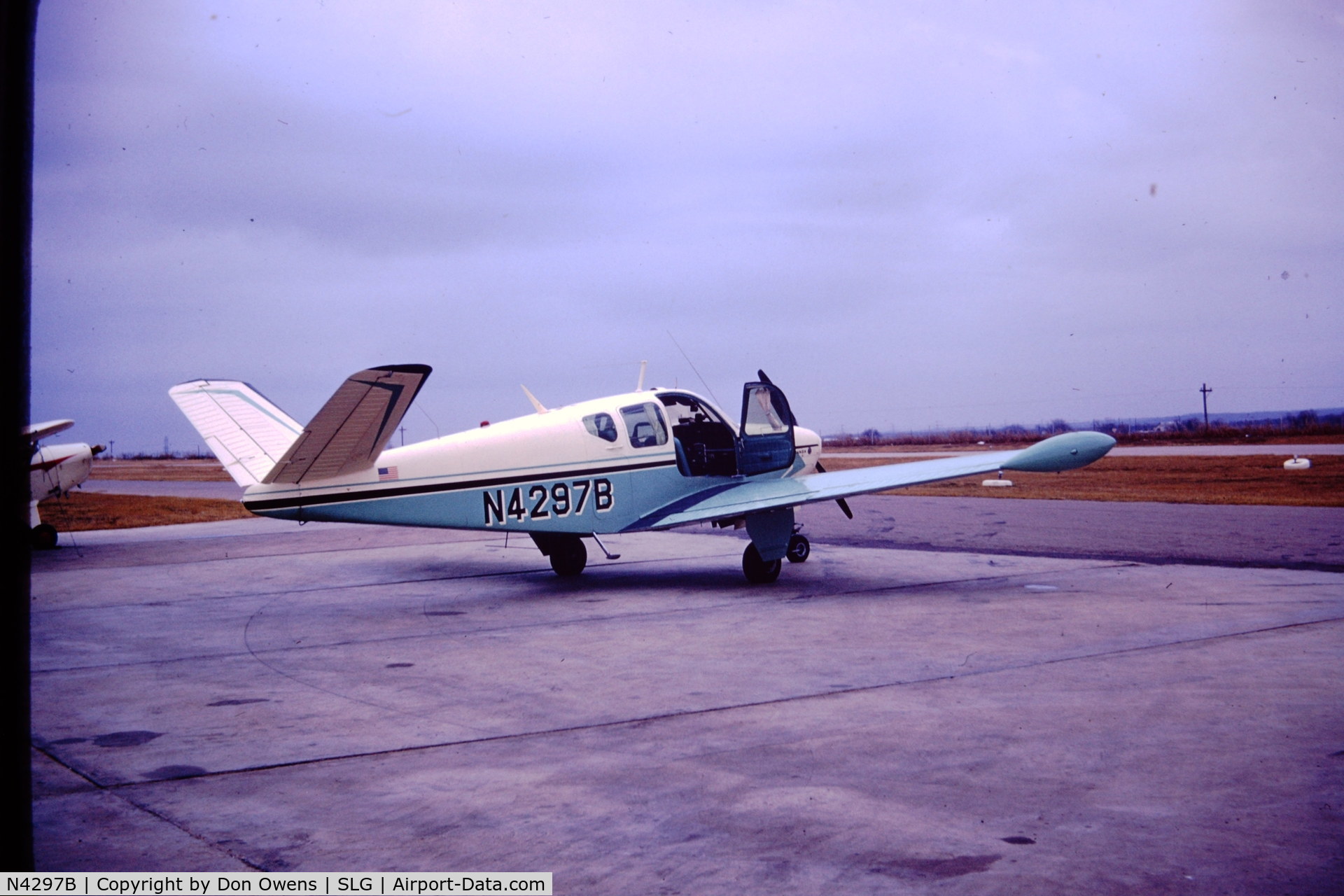 N4297B, 1955 Beech F35 Bonanza C/N D-4245, I took this photo in 1969. More recent photos show the tip tanks removed.