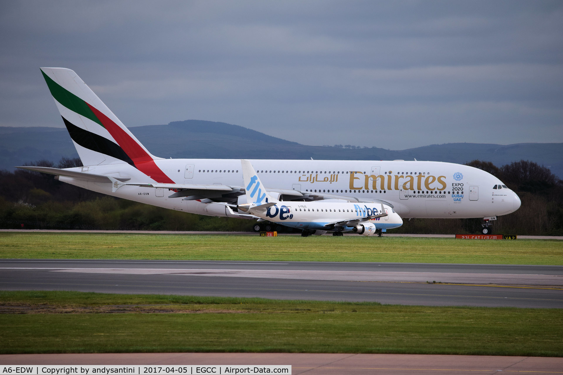 A6-EDW, 2012 Airbus A380-861 C/N 103, holding for takeoff 23L man egcc uk  at the side in the same shot [G-FBJG EMB175 BEE old col's waiting to line up on 23L