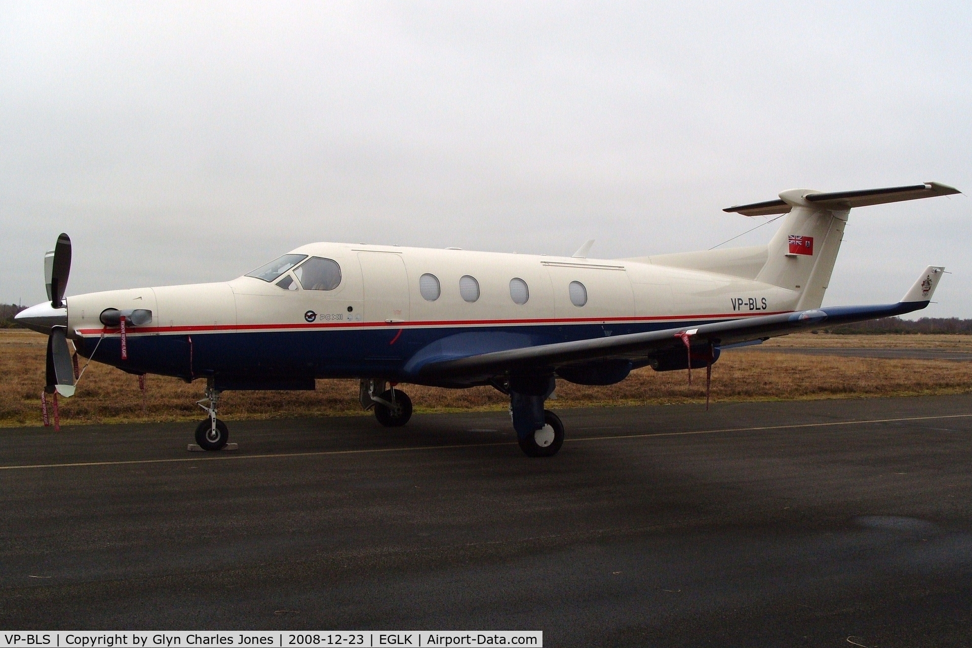 VP-BLS, 1997 Pilatus PC-12/45 C/N 176, Previously N176BS and HB-FSL. Parked down the far west end of Blackbushe. Had to walk through bramble and gorse bushes to get this photo. Front view.