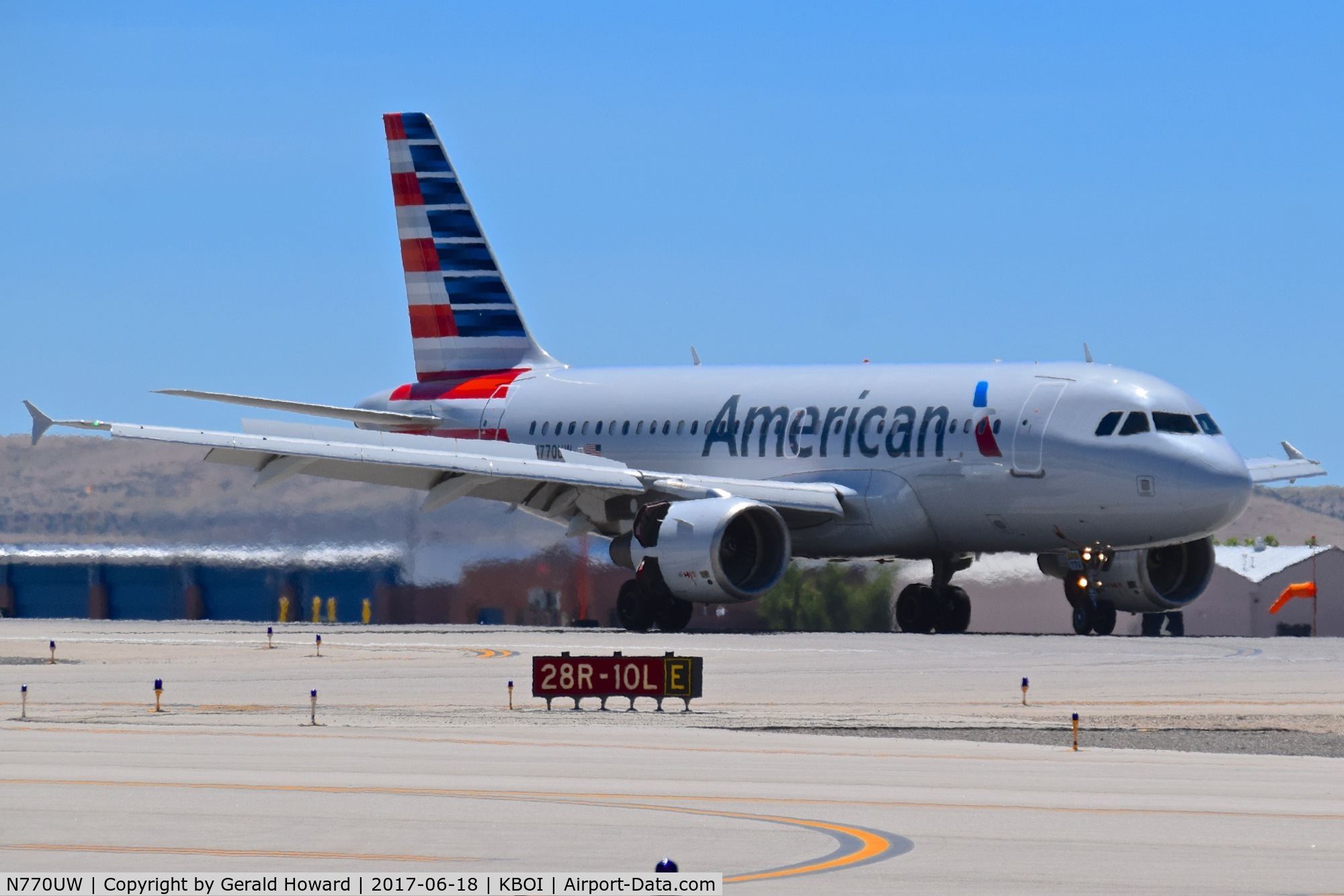 N770UW, 2000 Airbus A319-112 C/N 1393, Turning onto Echo from RWY 28R.