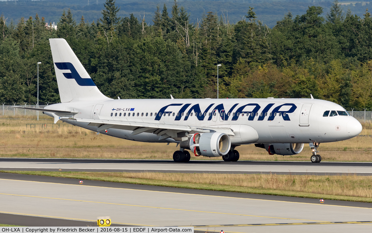 OH-LXA, 2001 Airbus A320-214 C/N 1405, decellerating after touchdown on RW07L