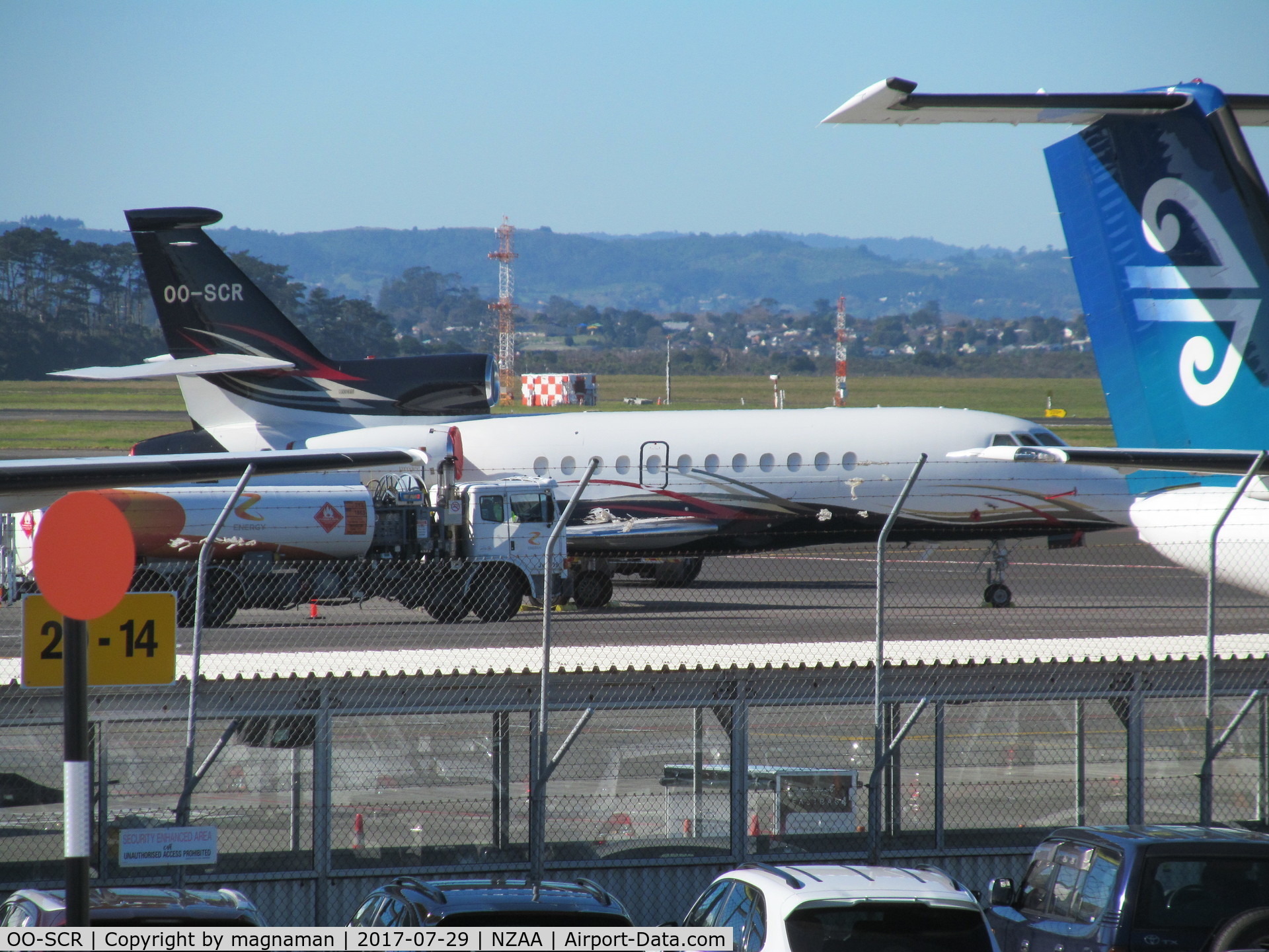OO-SCR, 2004 Dassault Falcon 900EX C/N 130, from car park roof across apron