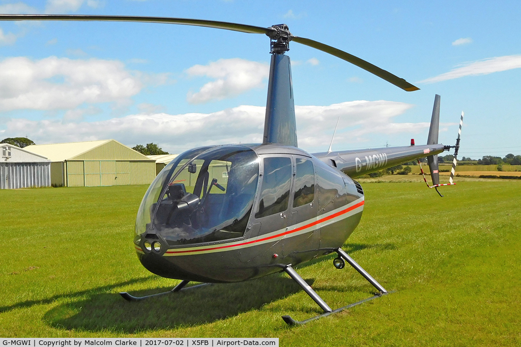 G-MGWI, 2000 Robinson R44 Astro C/N 0663, Robinson R44 Astro at Fishburn Airfield, UK. July 21nd 2017.