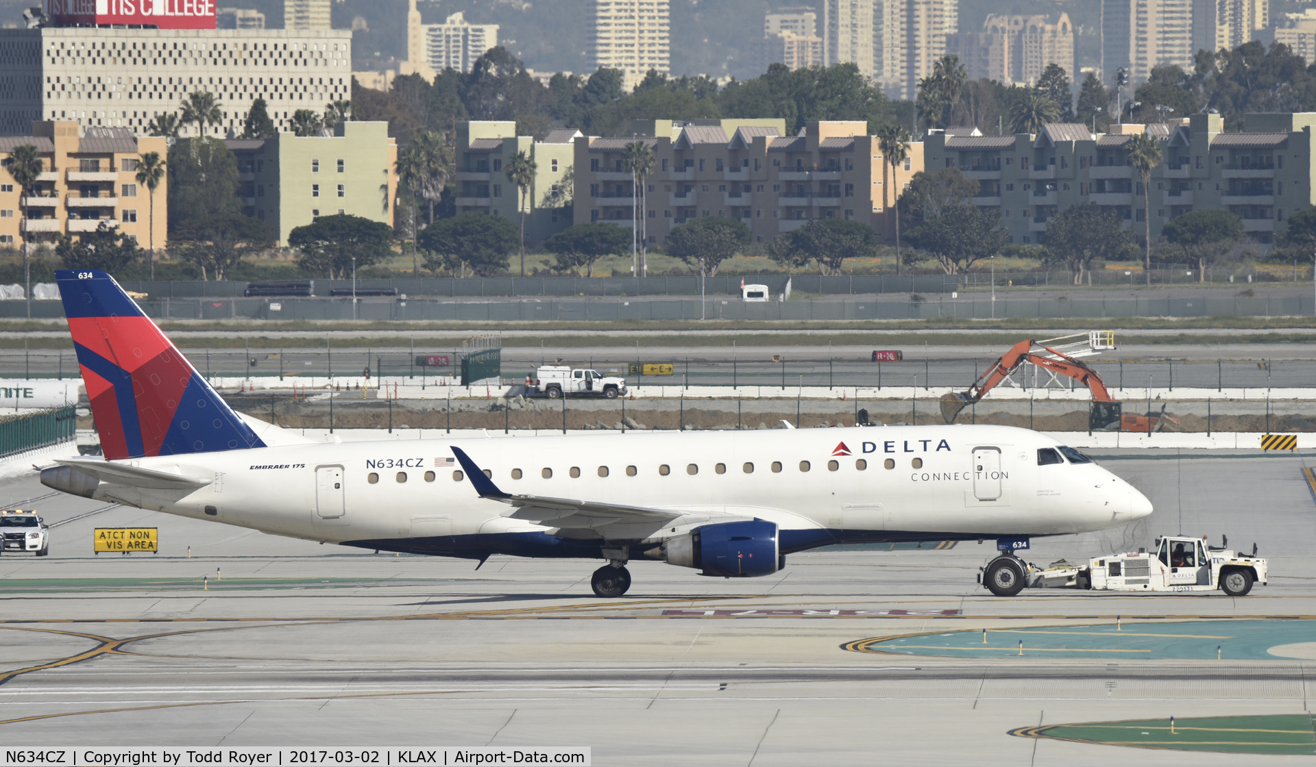 N634CZ, 2008 Embraer 175LR (ERJ-170-200LR) C/N 17000246, Getting towed to gate at LAX