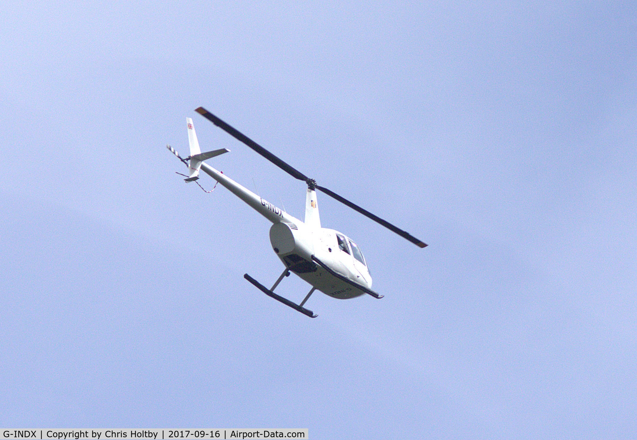 G-INDX, 2004 Robinson R44 Clipper II C/N 10491, Over Potters Bar, Herts showing new livery