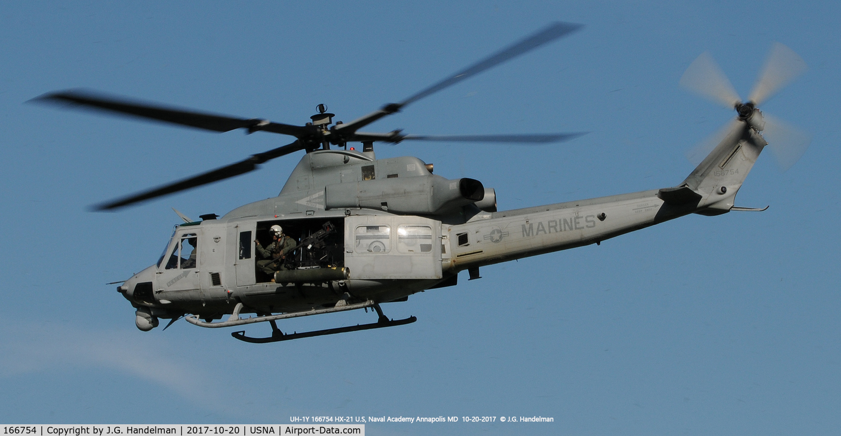 166754, Bell UH-1Y Venom C/N 55004/Y4, Lift off at U.S. Naval Academy.  Note .50 cal M-2 in port door opening.