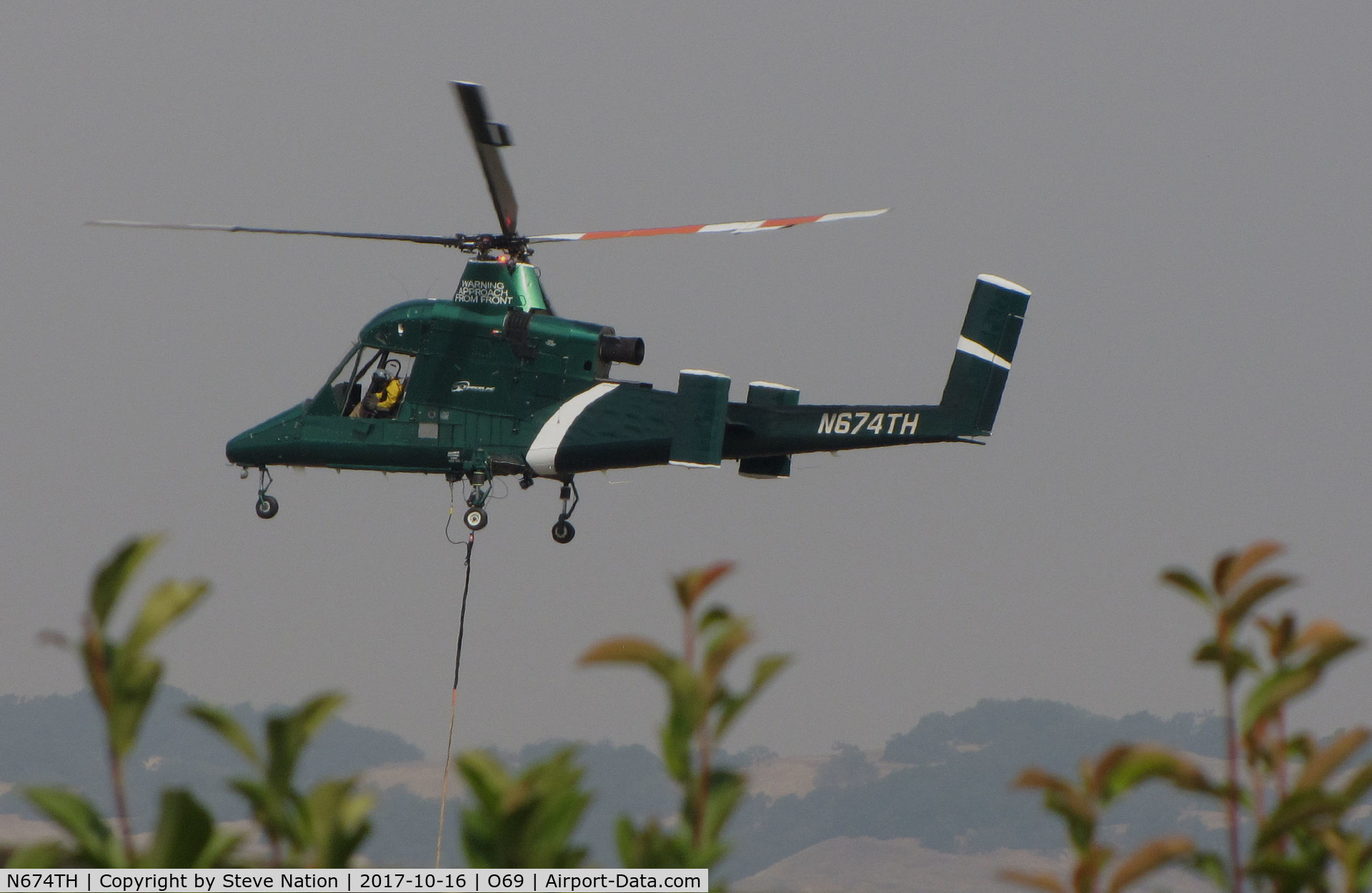 N674TH, 2004 Kaman K-1200 K-Max C/N A94-0035, Timberline Helicopters (Sand Point, ID) 2004 Kaman K-1200 K-MAX water dropping helicopter landing @ Petaluma Municipal Airport, CA temporary home base in support of efforts to control devastating Northern California Oct 2017 wildfires