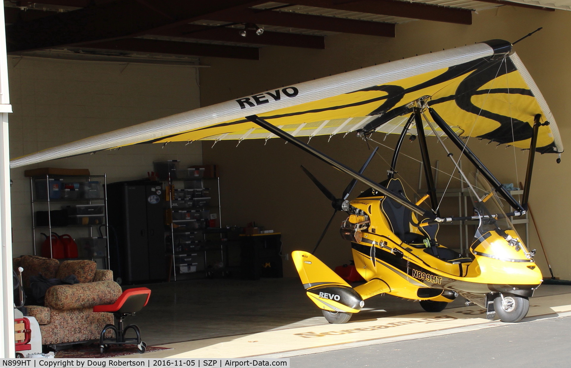 N899HT, 2016 Evolution Trikes Revo C/N 000618, 2016 Evolution Aircraft REVO RIVAL X, weight-shift control production LSA, Rotax 912ULS 100 Hp pusher, camera mounts-equipped. In its hangar.