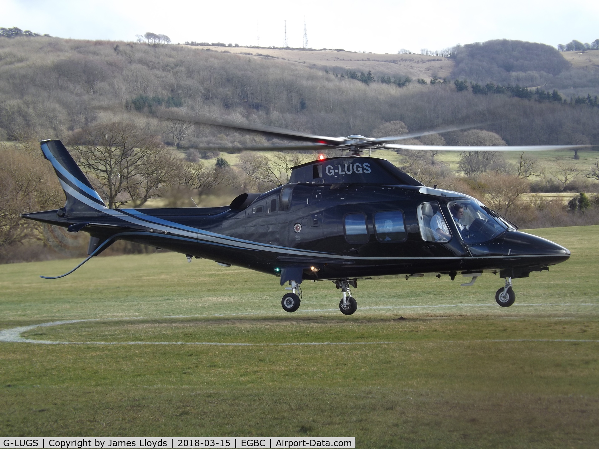 G-LUGS, 2009 Agusta A-109S Grand C/N 22125, Arriving at Cheltenham Helipad with pax for the Cheltenham Gold Cup.