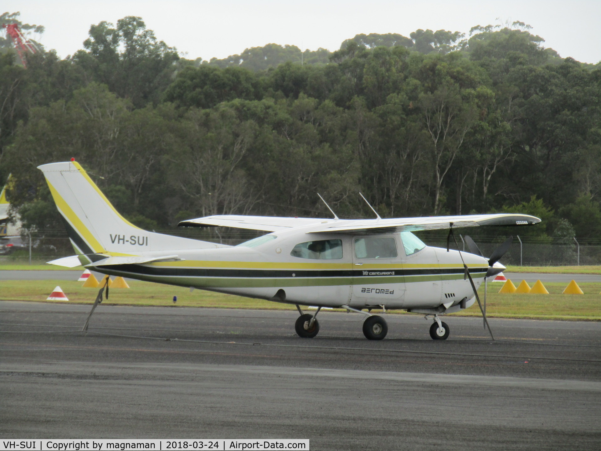 VH-SUI, Cessna T210N Turbo Centurion C/N 21063435, on apron in damp at caloundra