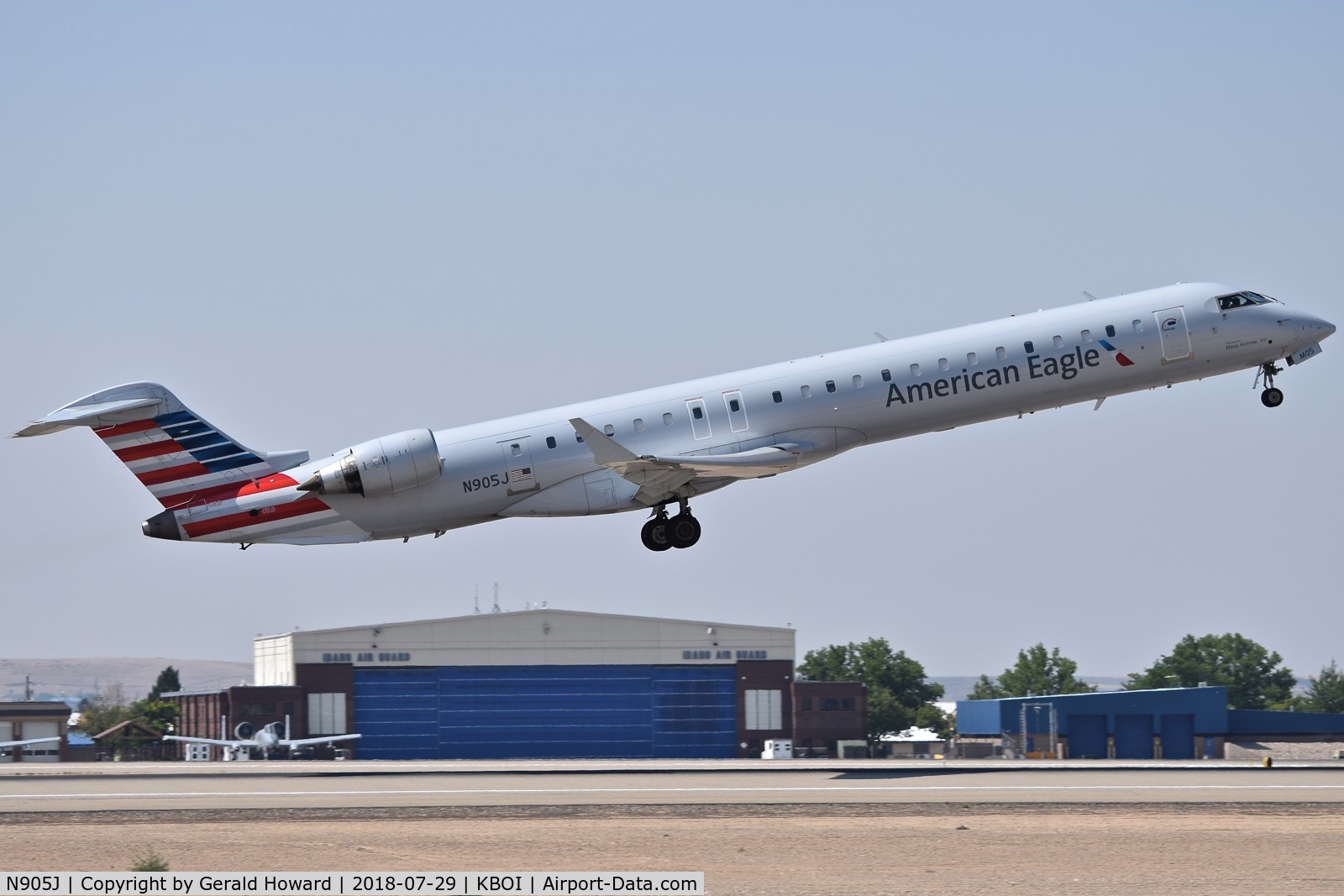 N905J, 2003 Bombardier CRJ-900 (CL-600-2D24) C/N 15005, Take off from RWY 28R.