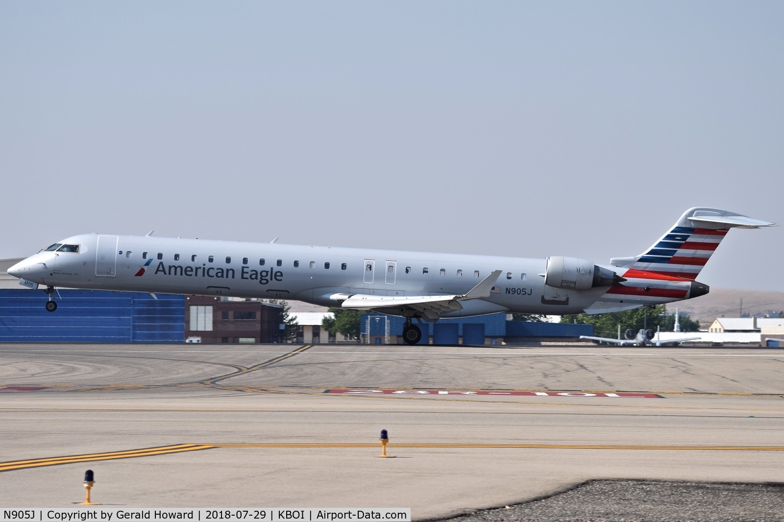 N905J, 2003 Bombardier CRJ-900 (CL-600-2D24) C/N 15005, Landing RWY 10L.