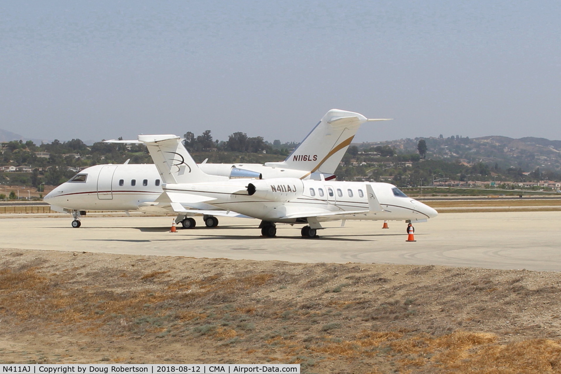 N411AJ, 2004 Learjet 40 C/N 40-2011, 2004 Bombardier Aerospace LEARJET 45, two Honeywell TFE731-20-1B turbofans flat rated at 3,500 lb st each with FADEC, on SUN AIR ramp in foreground.