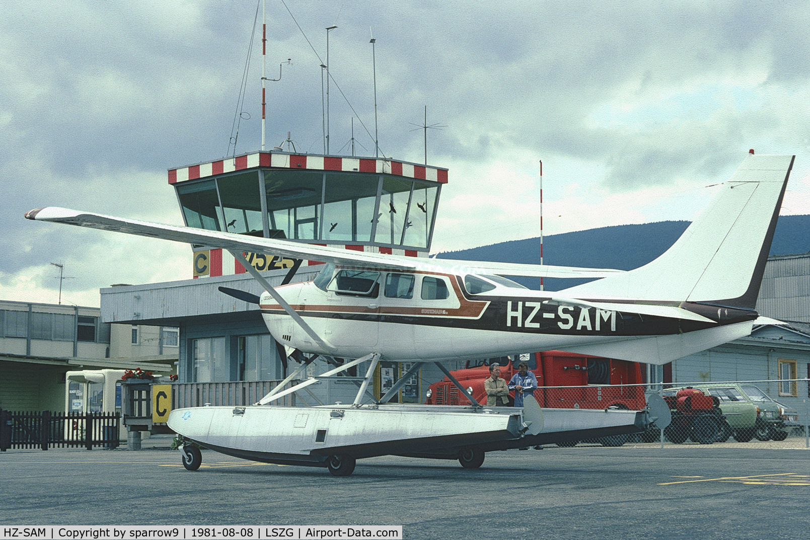 HZ-SAM, 1977 Cessna U206G Stationair C/N U20604128, At Grenchen in old paint-scheme. The old airport-building behind.