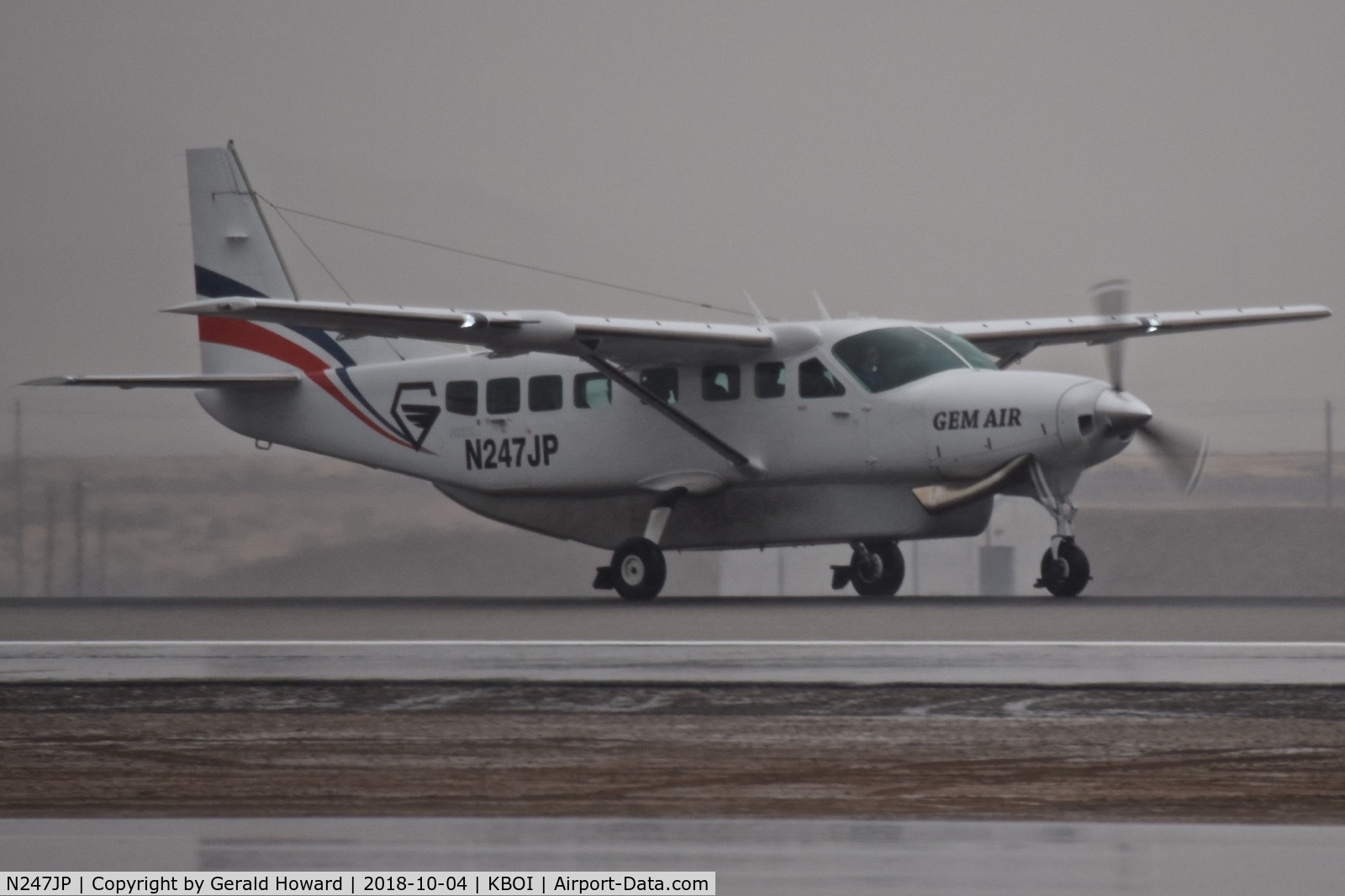 N247JP, 2013 Cessna 208B Grand Caravan EX C/N 208B5047, Wet runway.