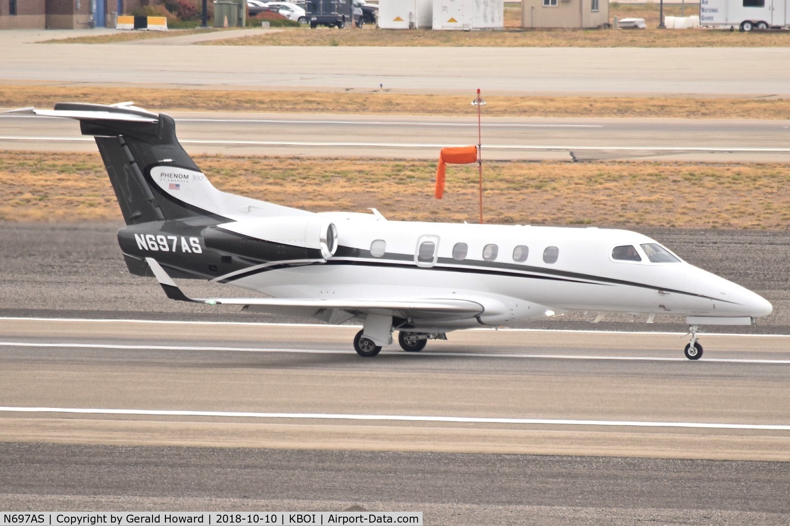 N697AS, 2011 Embraer EMB-505 Phenom 300 C/N 50500056, Landing roll out on RWY 28R.