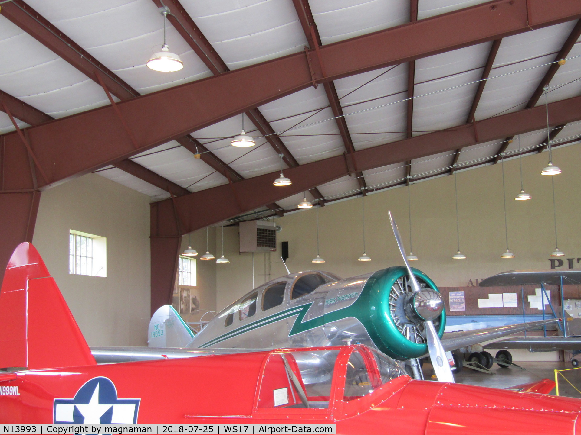 N13993, 1937 Spartan 7W Executive C/N 2, crowded hangars at Pioneer (OSH)
